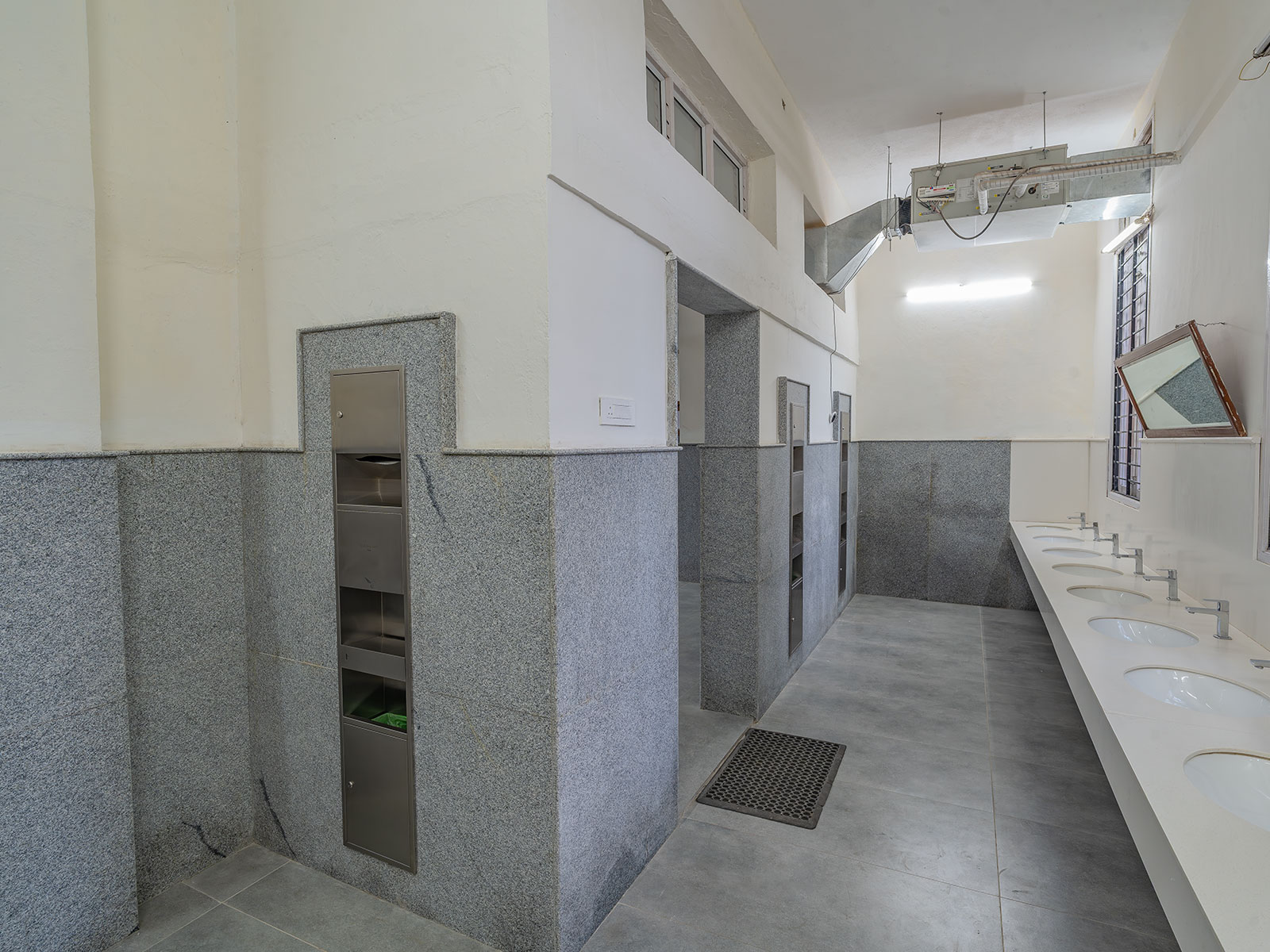 Clean modern WashArea with marble tiles